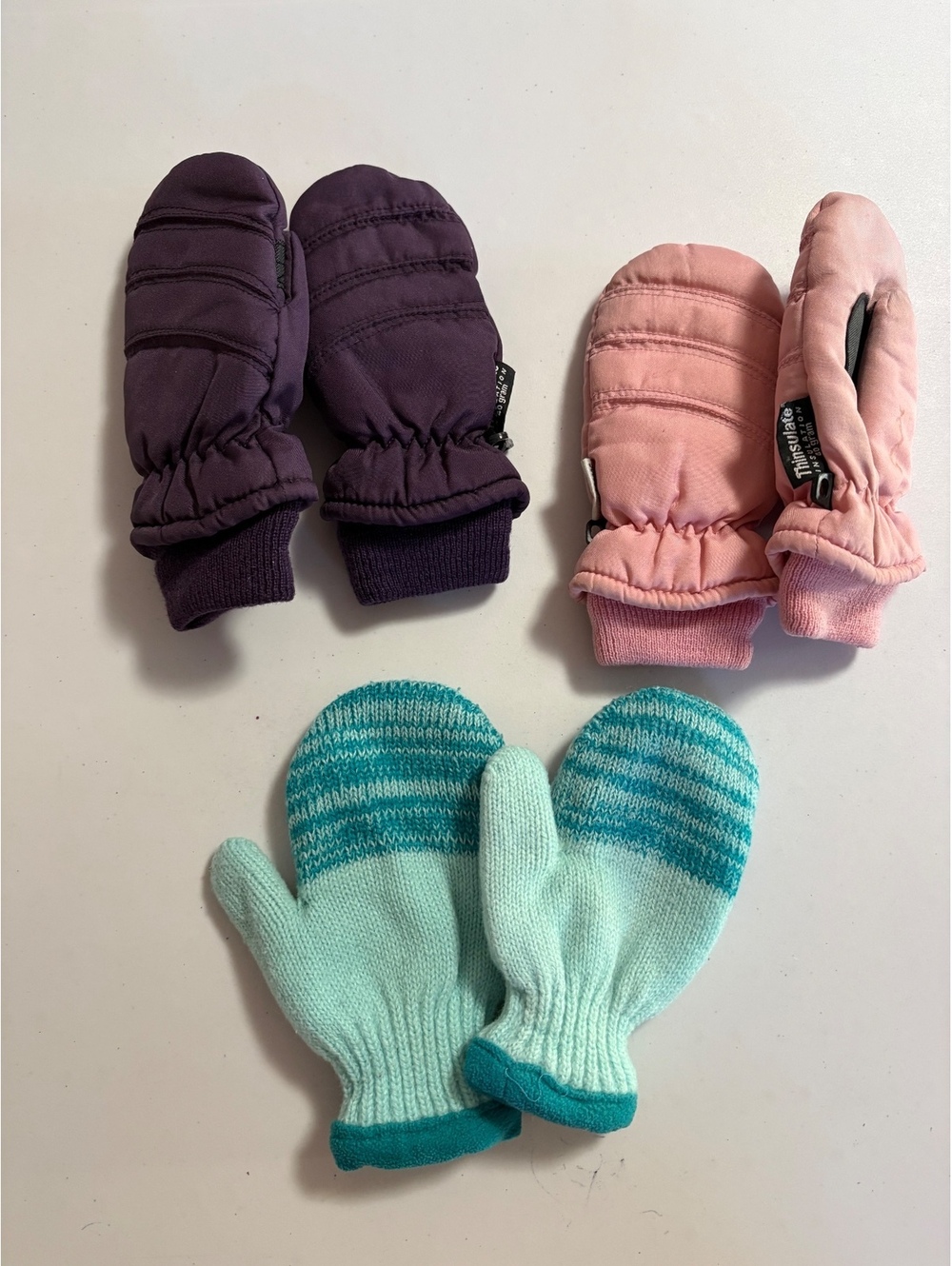 Three pairs of kid mittens